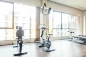 Abstract blur fitness equipment in gym room interior photo