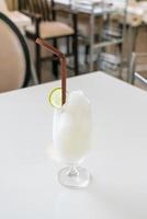 Fresh lemon-lime smoothie glass in cafe and restaurant photo
