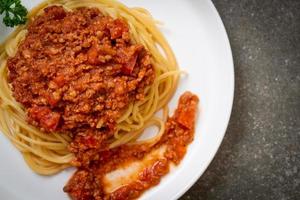 Spaghetti bolognese pork or spaghetti with minced pork tomato sauce - Italian food style photo