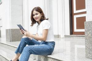 University student is holding tablet photo