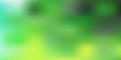 Light green, yellow vector abstract blur backdrop.