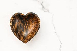 Wood bowl with heart shape photo