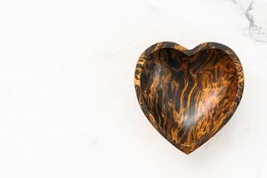 Wood bowl with heart shape photo