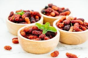 Black mulberry fruit in bowl photo