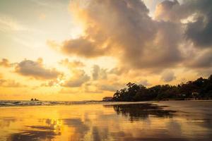 Beautiful sunset on the beach and sea photo