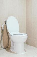 White toilet bowl and seat photo