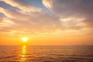 Beautiful sunset on the beach and sea photo