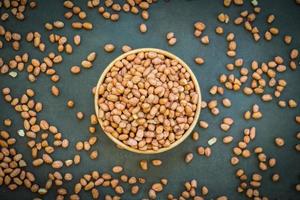 Peanuts in wooden bowl photo