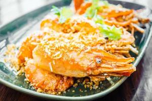 Fried prawn with garlic in plate photo