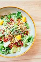 Grilled chicken with vegetable and pomegranate , fruits salad in plate - Color Filter Processing photo