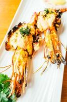 Grilled prawn or shrimp with sauce photo