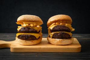 Hamburger or beef burgers with cheese and french fries - unhealthy food style photo