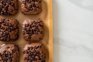 Dark chocolate brownies with chocolate chips on top photo