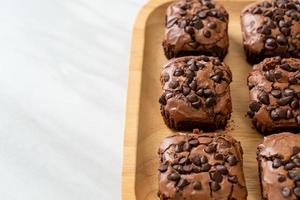 Dark chocolate brownies with chocolate chips on top photo