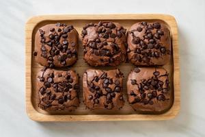 Dark chocolate brownies with chocolate chips on top photo