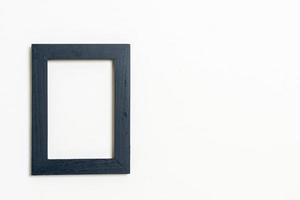 Empty picture frame on white wall background with copy space photo