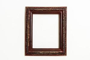 Empty picture frame on white wall background with copy space photo