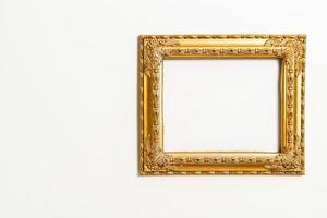 Empty picture frame on white wall background with copy space photo