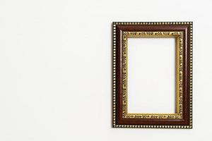 Empty picture frame on white wall background with copy space photo