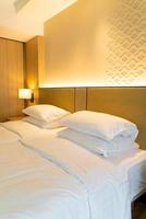 White pillow decoration on bed in hotel resort bedroom photo