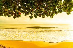 Beautiful and empty beach sea at sunrise or sunset time photo