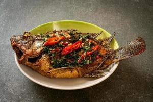 Fried Tilapia Fish with Basil chili garlic sauce photo