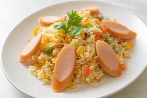 Fried rice with sausage and mixed vegetable photo