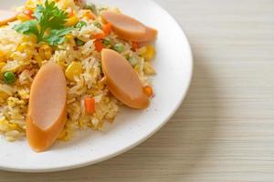 Fried rice with sausage and mixed vegetable photo