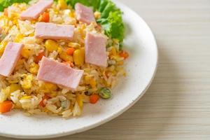 Homemade fried rice with ham and mixed vegetable of carrot, and green bean peas photo