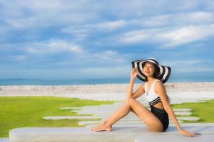 Portrait beautiful young asian women happy smile relax around swimming pool photo