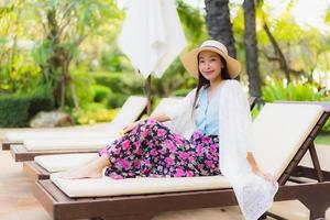 Portrait beautiful young asian women happy smile relax around swimming pool photo