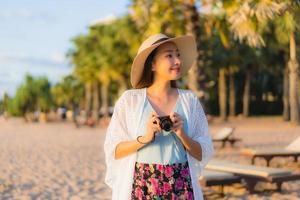 Portrait beautiful young asian women happy smile relax around beach sea ocean photo