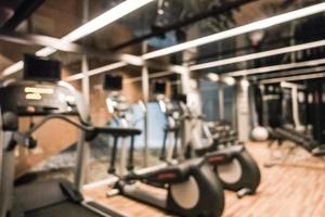 Abstract blur defocused fitness equipment and gym interior photo