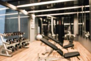 Abstract blur defocused fitness equipment and gym interior photo