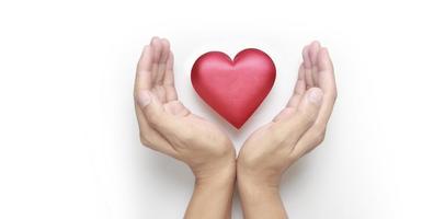 Hands holding  red heart. heart health donation concepts photo