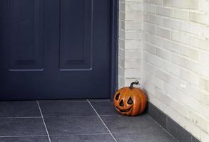 Halloween pumpkin on a door photo