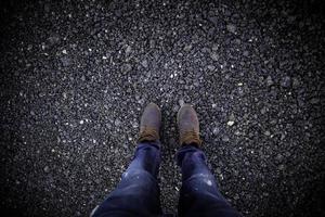 Men's boots in a forest photo