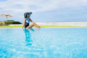 Portrait beautiful young asian women happy smile relax around swimming pool photo