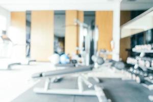 Abstract blur and defocused gym equipment and fitness room interior photo