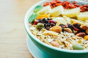 Mixed fruit with muesli and granola photo