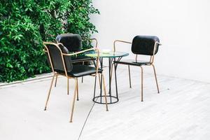 Furnitures with empty chair and table photo