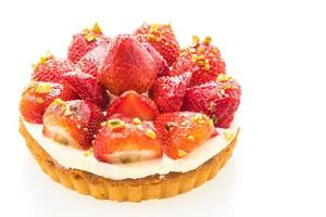 Sweet dessert with strawberry on top of tart photo