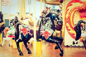Carousel horse in the park photo
