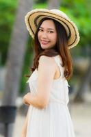 Portrait beautiful young asian woman happy and smile on the beach sea and ocean photo