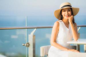 Portrait beautiful young asian woman smile happy in the sky bar and restaurant photo