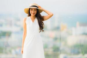 Portrait beautiful young asian woman happy smile relax on the roof top bar photo