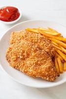 Fried chicken breast fillet steak with French fries and ketchup photo