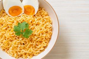 Instant noodles bowl with salt egg photo