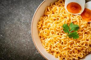 Instant noodles bowl with salt egg photo