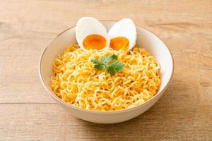 Instant noodles bowl with salt egg photo